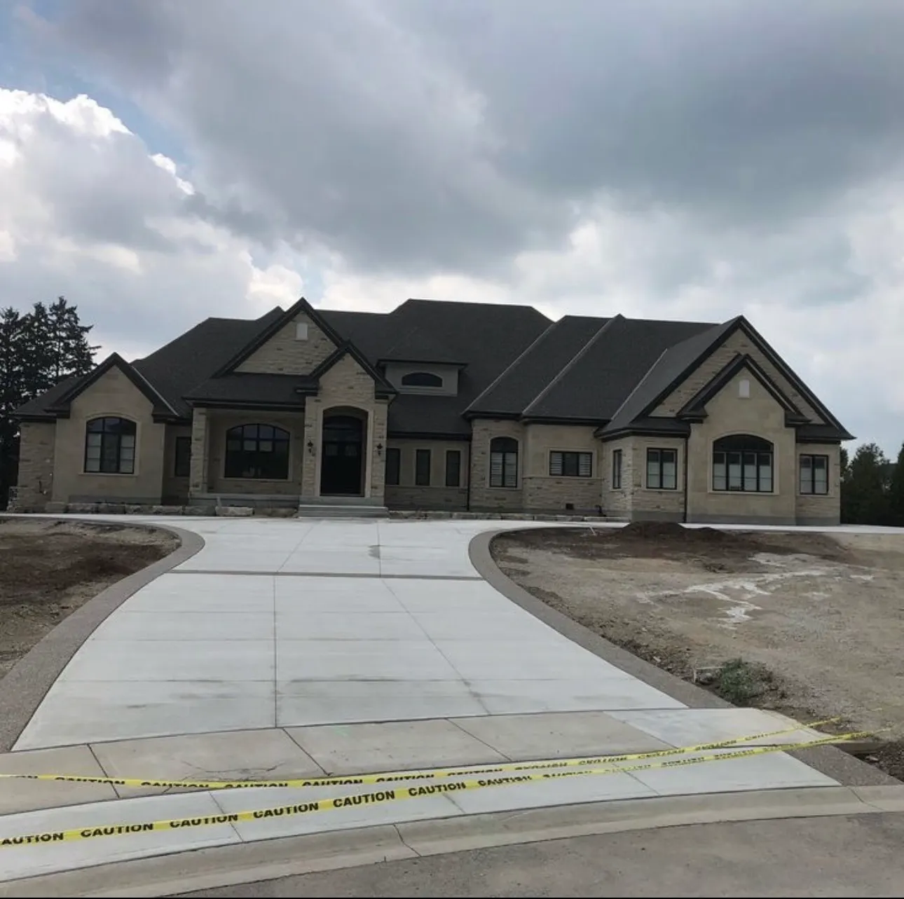 New broom-finished concrete driveway poured by Rhino Concrete in Charlotte NC