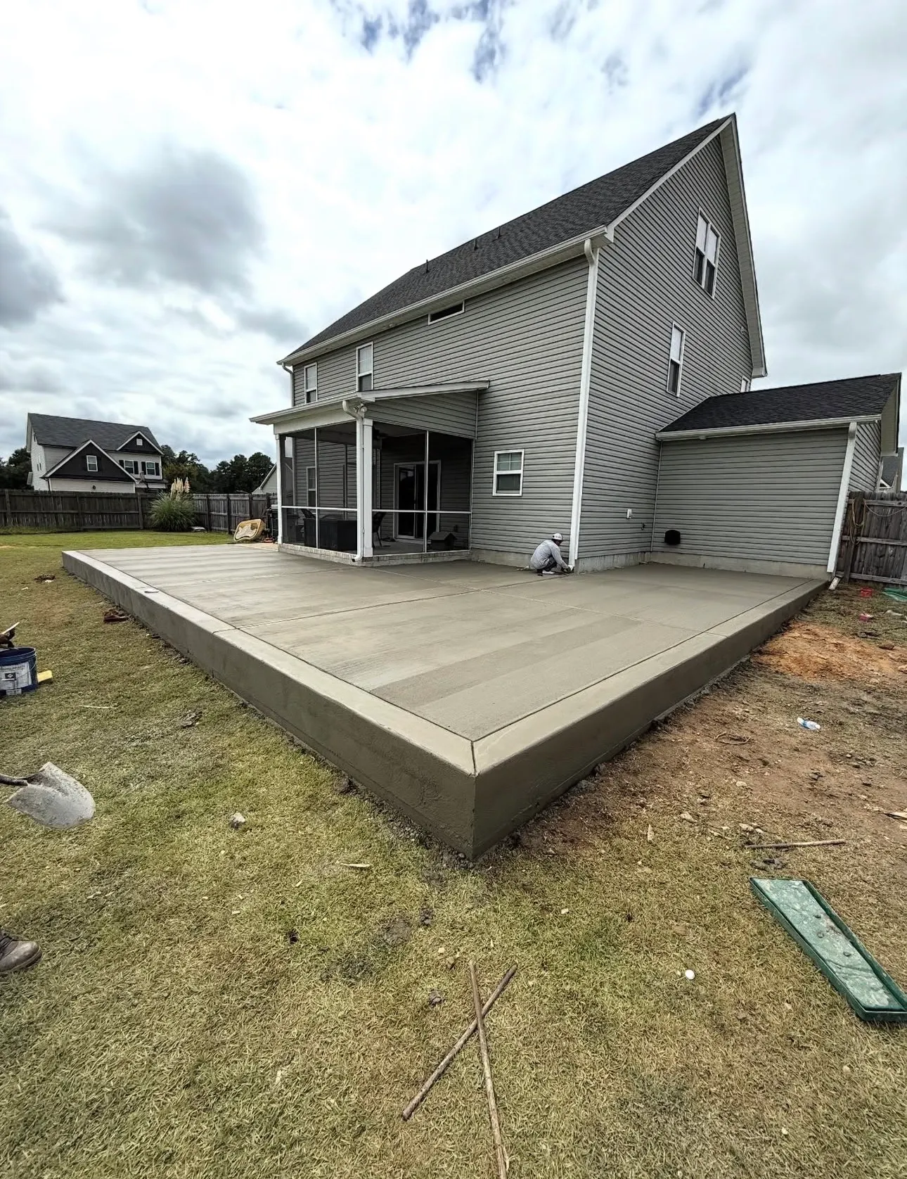 Clean re-poured broom-finish concrete slab at a Charlotte home