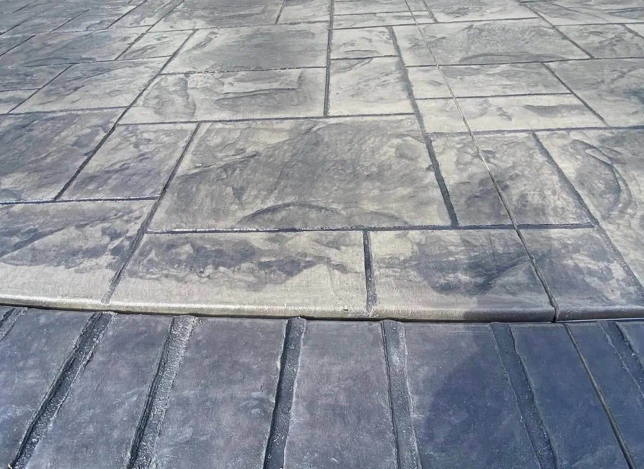 Close-up of slate-pattern stamped concrete finished by Rhino Concrete in Charlotte NC
