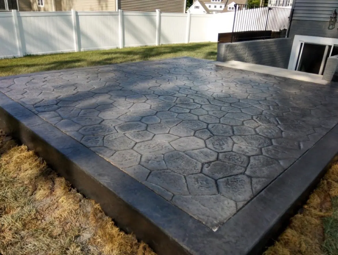 Freshly poured concrete slab pad at a Charlotte residence
