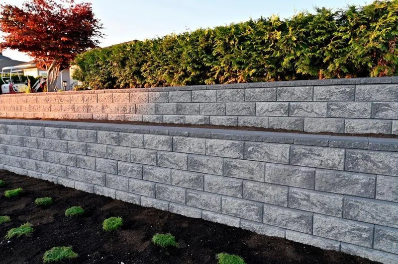 Concrete block retaining wall built on a graded Charlotte yard by Rhino Concrete