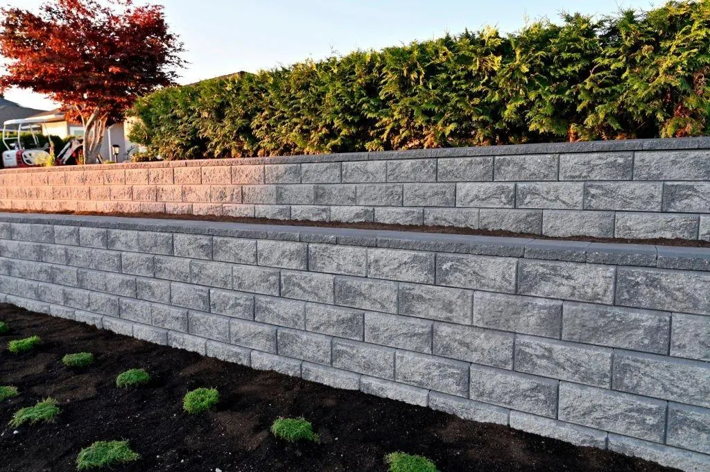 Concrete block retaining wall built on a graded Charlotte yard by Rhino Concrete