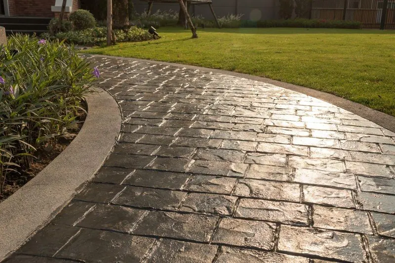 New concrete walkway leading to a Charlotte home's front entrance